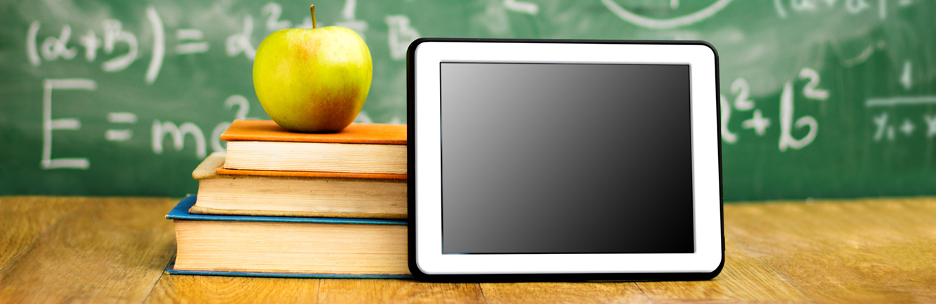 Educational Resources green apple on books next to tablet