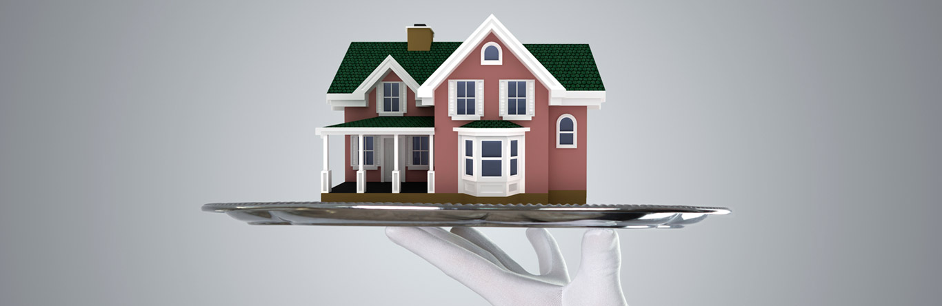 silver platter holding model house